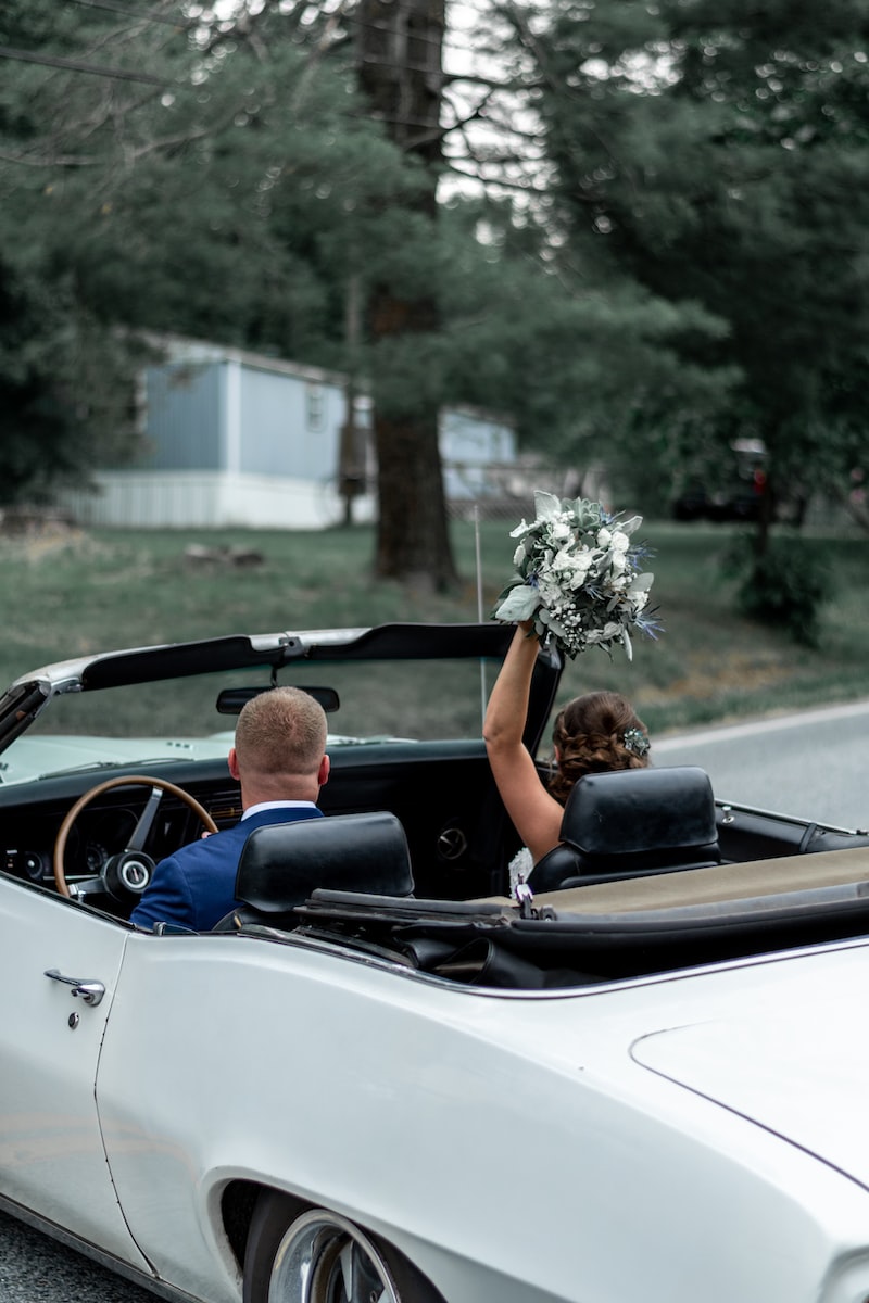 a person riding on the back of a car